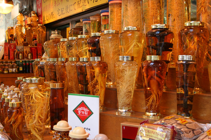 Ginseng and reishi mushrooms in bottles being sold in Seoul, Korea